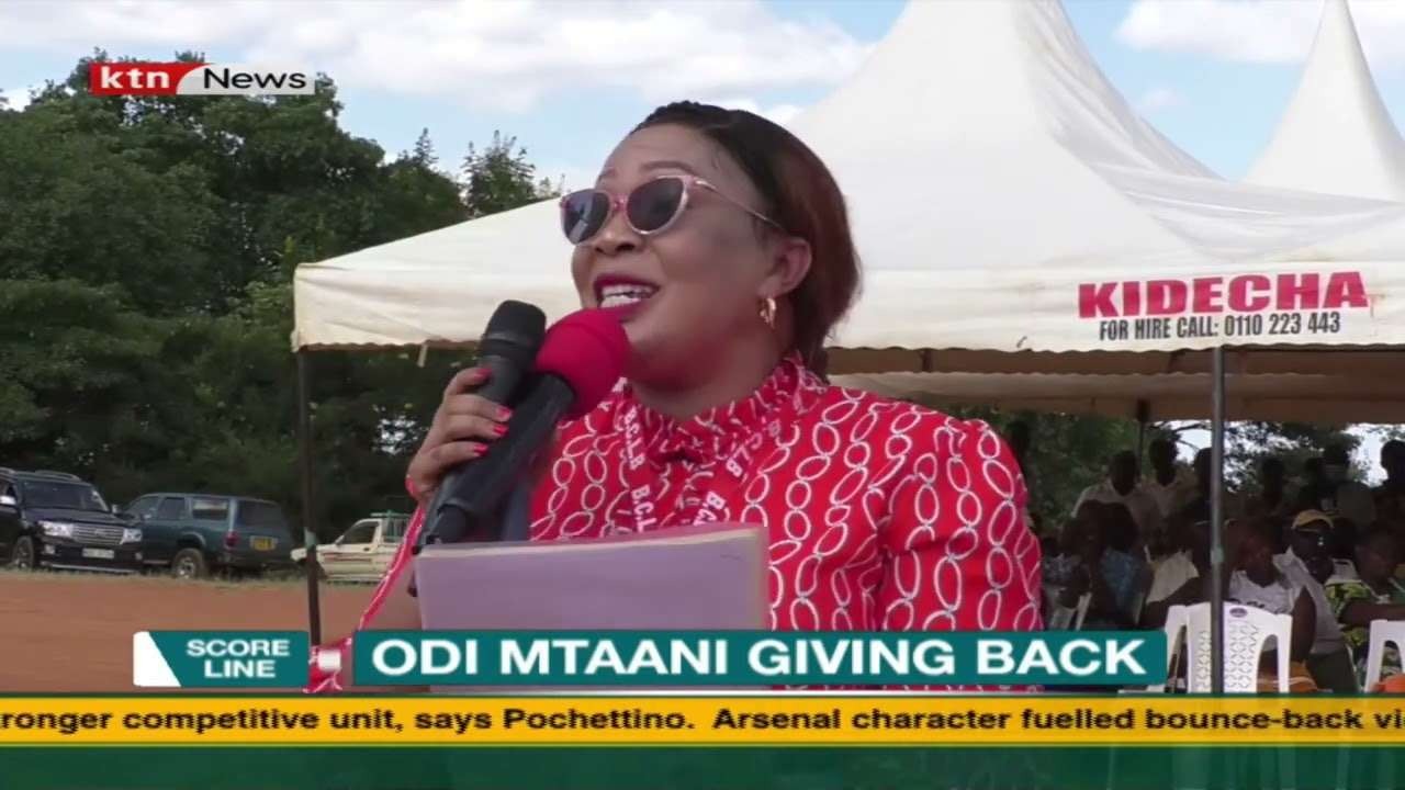 Woman speaking at Odi Mtaani event.